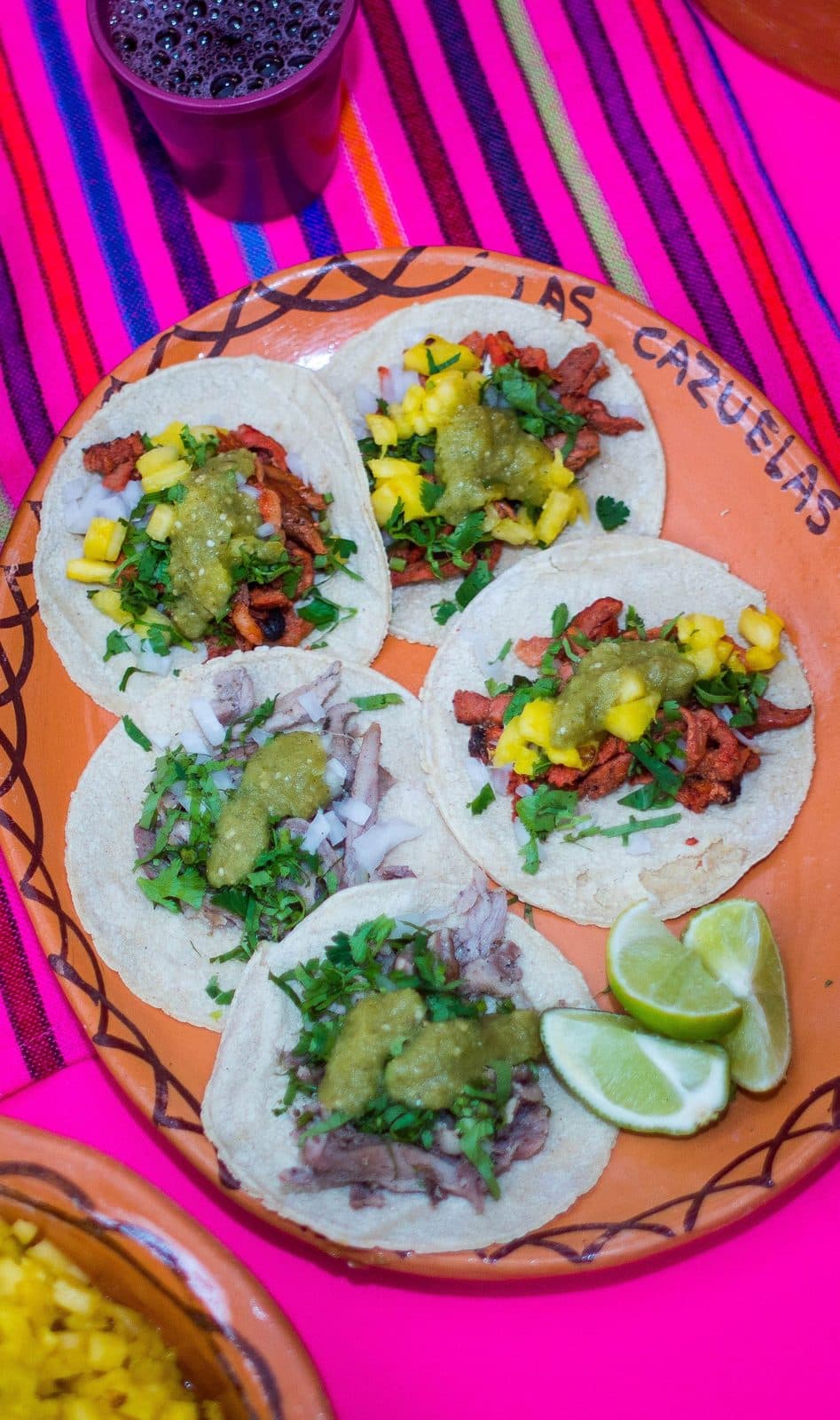 Al pastor street tacos with cilantro and onion at Juanito's Tacos