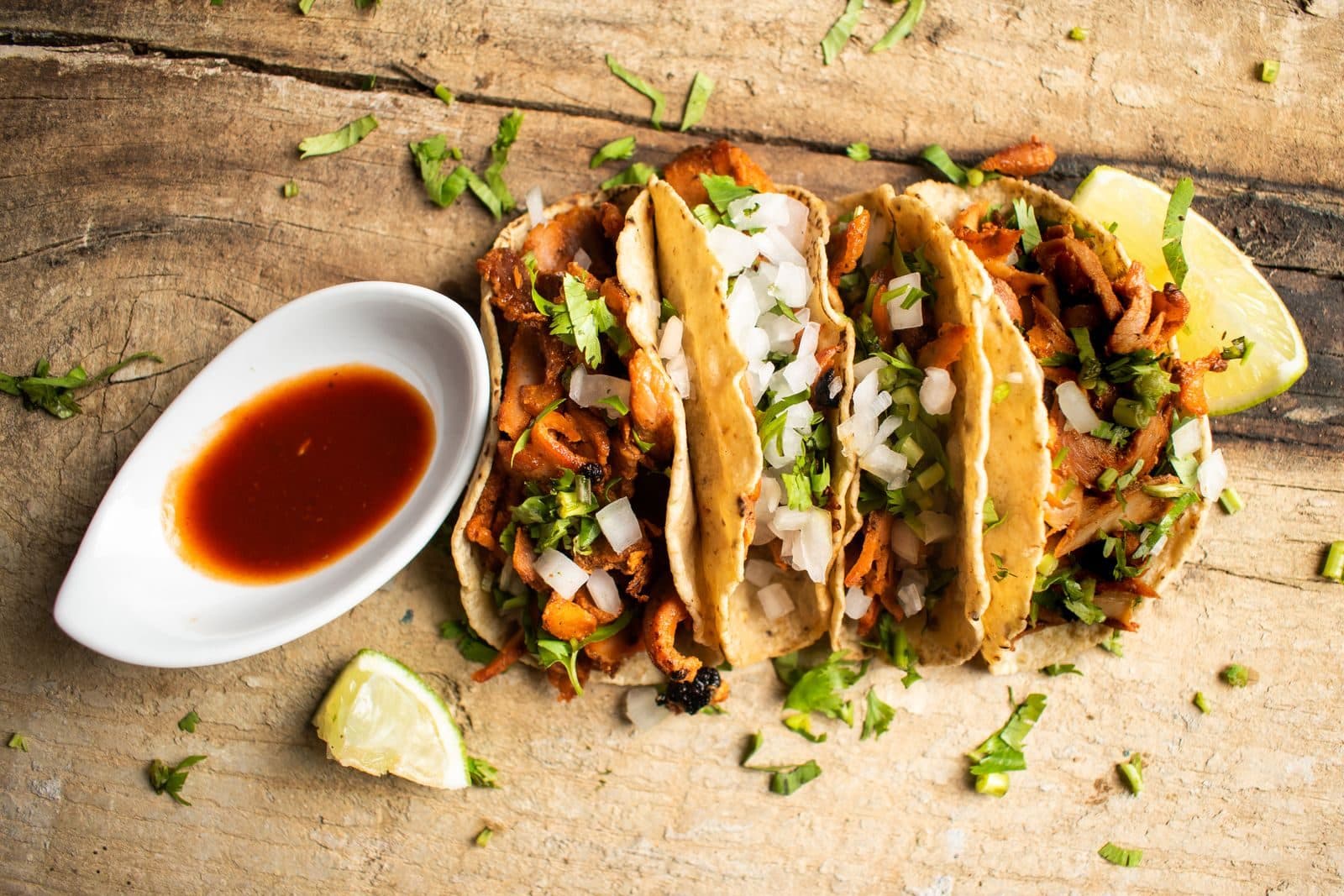 Fresh Mexican street tacos with cilantro, onion, salsa and lime from Juanito's Tacos in Urbana, Illinois
