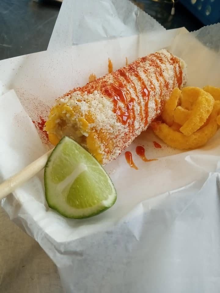 Elote, Mexican street corn in a cup with mayo, cheese, chili powder and lime at Juanito’s Tacos