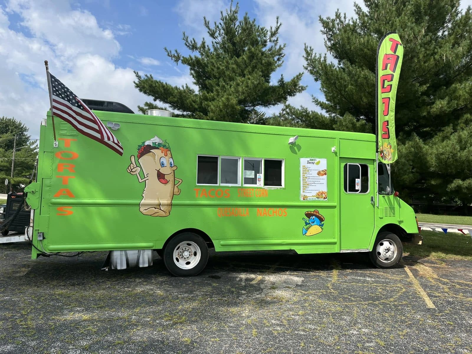 The bright green Juanito’s Tacos food truck serving Mexican street food in Urbana, Illinois