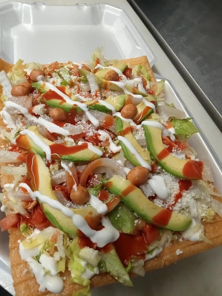Loaded nachos with meat, melted cheese, avocado and pico de gallo at Juanito’s Tacos